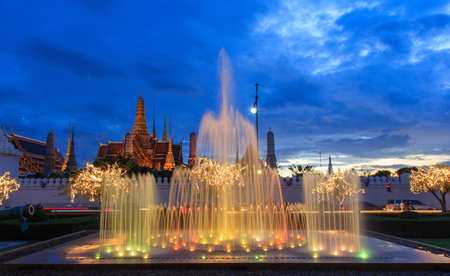 Close up fountain at night light  landmark of Sanam Luang and Emerald Buddha Temple (Wat Phra Kaew) background, Bangkok, Thailandの写真素材