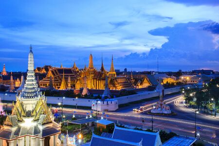 The beauty of the Emerald Buddha Temple at twilight. And while the gold of the temple catching the light. This is an important buddhist temple of thailand and a famous tourist destination.の写真素材