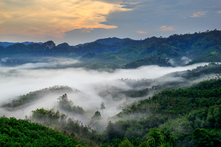 Mountains and mist with morning light.の写真素材