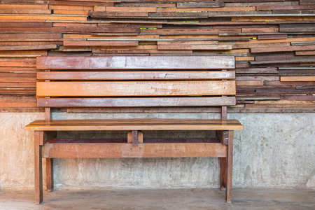 Vintage red chair with wood wall.