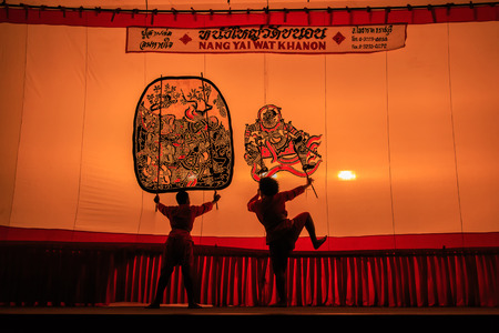 RATCHABURI, THAILAND - APRIL 18: Large Shadow Play is performed at Wat Khanon on April 18, 2015. The ancient performing art involves manipulating puppets of cowhide in front of a backlit whiteのeditorial素材