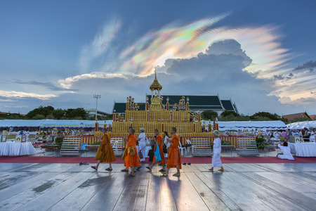 BANGKOK, THAILAND - JUNE 6: ceremony cremation of Buddha (simulation) with the monk and people activities a lot. This is a natural phenomenon. Cloud beautiful rainbow in the sky as a backdrop.のeditorial素材