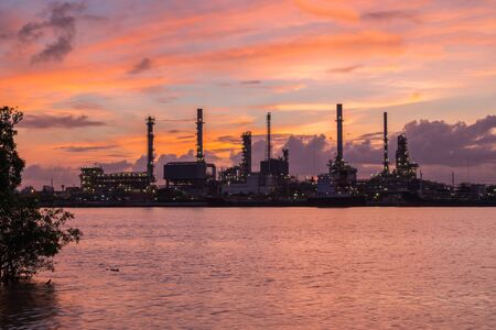 Oil refinery along the river at Dusk (Bangkok, Thailand)