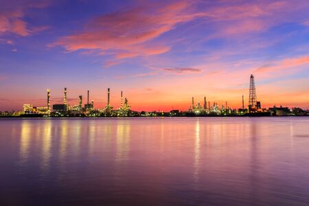 Oil refinery along the river at Dusk (Bangkok, Thailand)の写真素材