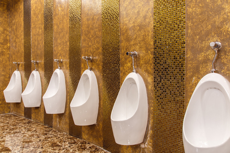 Urinals in an old building for men only.の写真素材