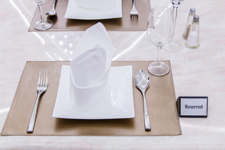 Reserved sign on a table in restaurant