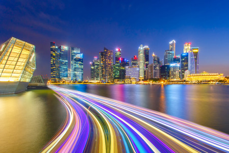Landscape of the Singapore financial district and business building with speed light on the river.のeditorial素材