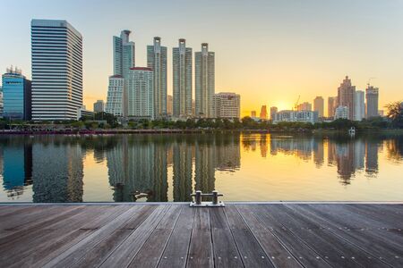 Bangkok city downtown at sunrise with reflection in Bangkok,Thailandの写真素材