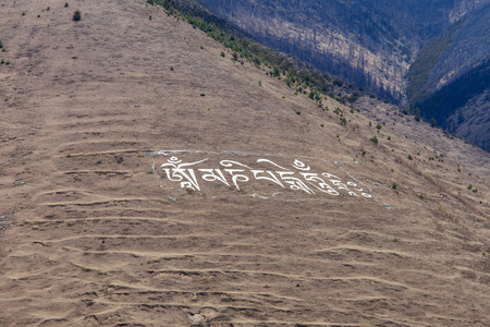 Tibetan prayer in the mountain with letters. / faith Chinaの写真素材