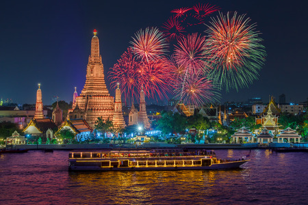 Wat arun and cruise ship in night time under new year celebration, Bangkok city ,Thailandの写真素材