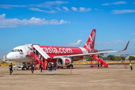 UBON RATCHATHANI, THAILAND - FEBRUARY 4: Passengers is up to a Thai Air Asia plane at Ubon Ratchathani Airport on February 4, 2017 in Ubon Ratchathani, Thailand.のeditorial素材