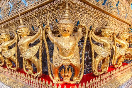 Perspective view of golden religious statue (Statue Garuda) in wat phra kaew temple, Bangkok, Thailand.の写真素材
