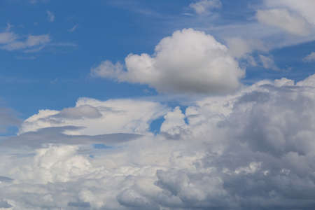 Blue sky with clouds background.