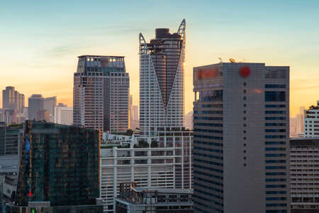 Aerial view modern office buildings in Bangkok city downtown with sunset time, Bangkok, Thailandの写真素材