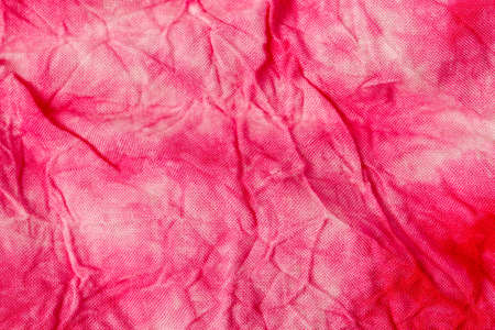 Red batik fabric texture and textile background.の写真素材