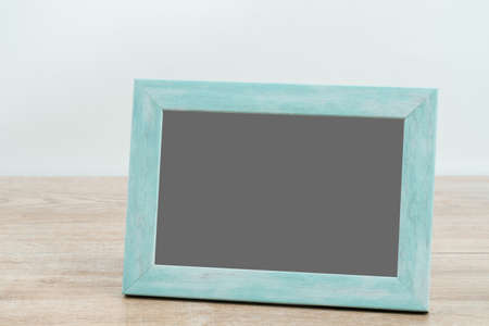 Picture frame on wooden texture background.の写真素材