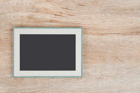 Picture frame on wooden texture background.の写真素材