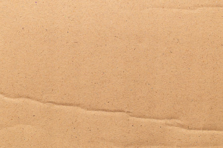 Brown color eco recycled kraft paper sheet texture cardboard background.の写真素材