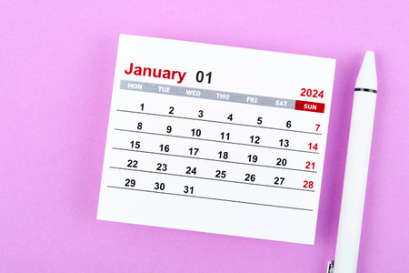 Calendar desk 2024: January is the month for the organizer to plan and deadline with a white pen against a purple background.の写真素材