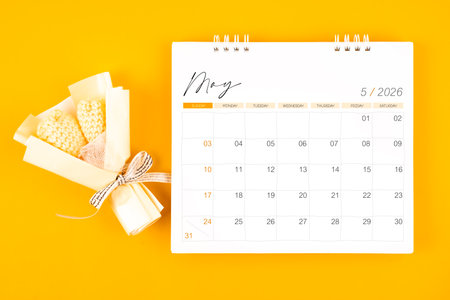2026 May desk calendar and Yellow bouquet on yellow color background.の写真素材