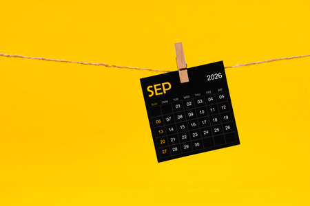September 2026 black calendar hanged with brown rope on yellow color background.の写真素材