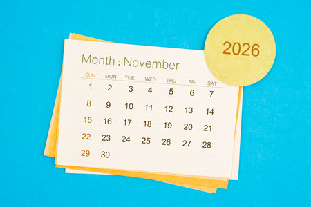November 2026 calendar page on blue color background.の写真素材