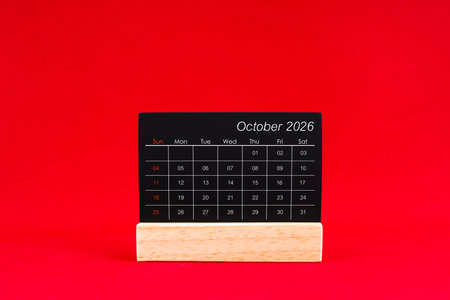 October 2026 chalkboard calendar on red background.の写真素材