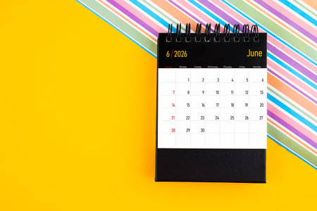 Desk calendar for June 2026 year on yellow background, Position with copy space.の写真素材
