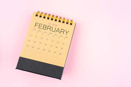Brown calendar for February 2026 on pink background, Planning concept.の写真素材
