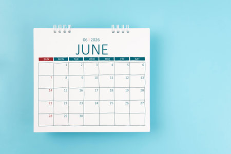 June 2026 Monthly desk calendar for 2026 year on blue background. Flat lay.の写真素材