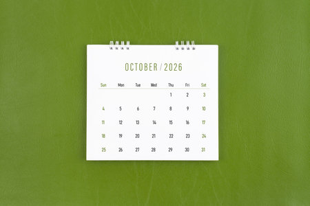 October 2026 Monthly desk calendar on green leather background.の写真素材
