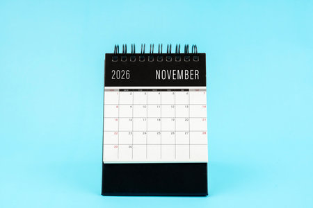 November 2026 Monthly desk calendar for 2026 year on blue color background.の写真素材