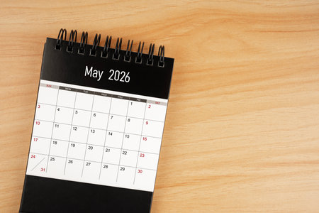 May desk calendar for 2026 year on wooden floor background.の写真素材