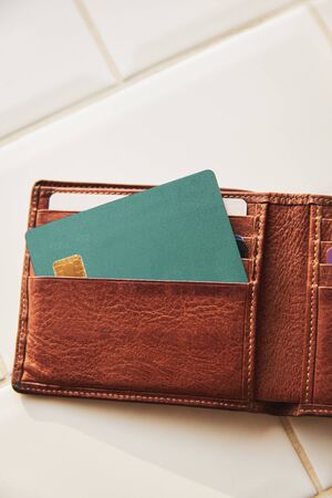 Blank credit or debit card in leather wallet.の写真素材
