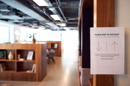 Social distancing sign in office please keep to right