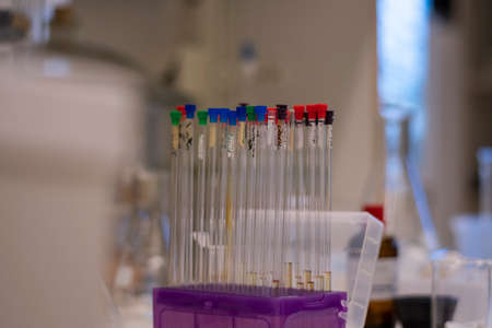 Nuclear magnetic resonance NMR tube kept in a line in box for chemical analysis of reaction in a...