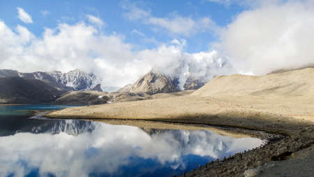 Beautiful landscape of vast sky mountain and lake with reflection of cloud in clean water in nature...