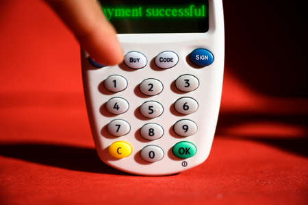 Online customer payment successful message on a bank e-card reader machine for online shopping from...