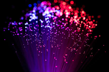 Defocused Lights over Dark, black background. Colourful festival season background copyspace....