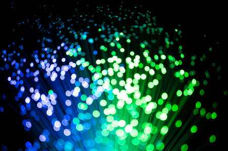 Defocused Lights over Dark, black background. Colourful festival season background copyspace. optical fibre Night Lights. Glowing rainbow drops and sparkles. Digital art. 3D rendering.の写真素材