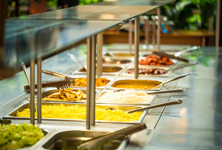 Asian food buffet in restaurant multiple food dishes and salad. Eat as much as you like Indian buffet restaurant. You can buy delicious food at an affordable price. Copyspace.の写真素材