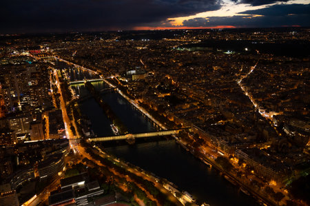 High Resolution Panorama Of Paris Skyline during rainy sunset. Night time light from the city roads and buildings.の写真素材