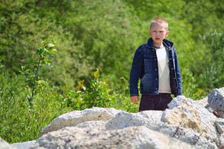 The offended child, has quarrelled with friends playing on picnicの写真素材