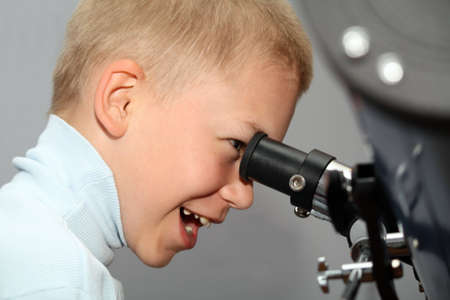 Boy with  telescopeの写真素材
