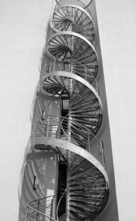 metal spiral stairs on the outside of a factory