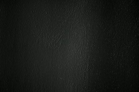 a dark concrete wall as a background