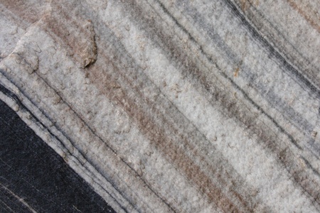 close up of stone texture with dark and light stripes