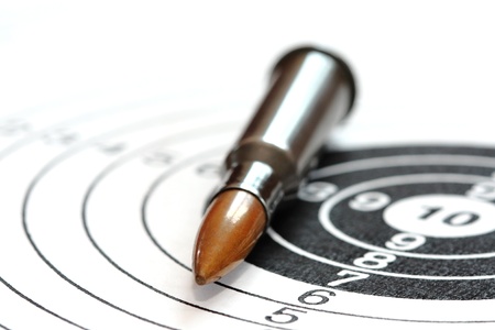 single rifle bullet on paper target for shooting practice の写真素材