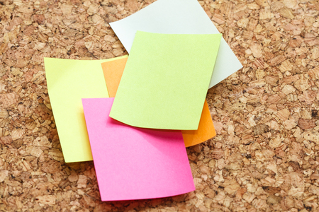 several empty colorful sticks on cork backgroundの写真素材