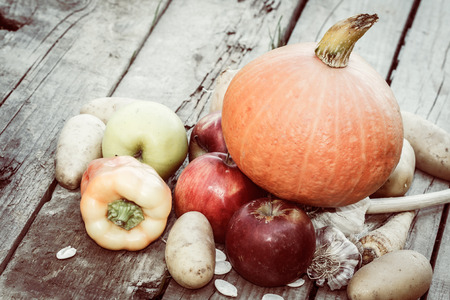 autumn vegetables - pumpkin, paprika, apples, garlic and potatoes